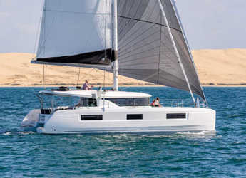 Rent a catamaran in Marina Frapa - Lagoon 46 (2022) equipped with a/c (salon + cabins), generator, ice maker, 2x SUP