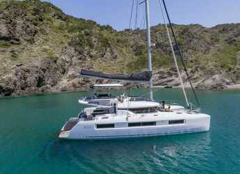 Rent a catamaran in Naviera Balear - Lagoon 51 (LUXURY Equipped, SUPs, Watertoys, A/C, W-Maker, Gen, Teak, Wi-Fi, Underwater Lights,...