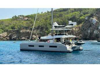 Rent a catamaran in Naviera Balear - Lagoon 55 SlowDown (LUXURY Equipped, SUPs, Watertoys, A/C, W-Maker, Gen, Teak, Wi-Fi, Underwater Lights,...