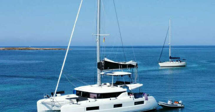 Rent a catamaran in Naviera Balear - Lagoon 46 Infinity Owner's Version  (LUXURY Equipped, SUPs, Watertoys, A/C, W-Maker, Gen, Teak, Wi-Fi, Underwater Lights,...