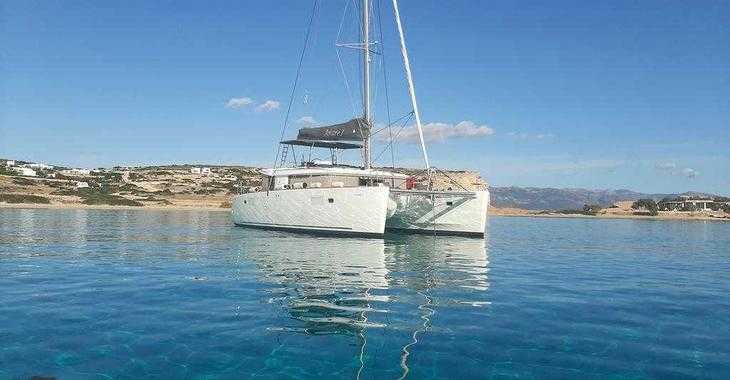 Rent a catamaran in Mykonos Marina - LAGOON  450F AMARE I / SKIPPERED ONLY / FREE STAND UP PADDLE / BOW CUSHIONS 